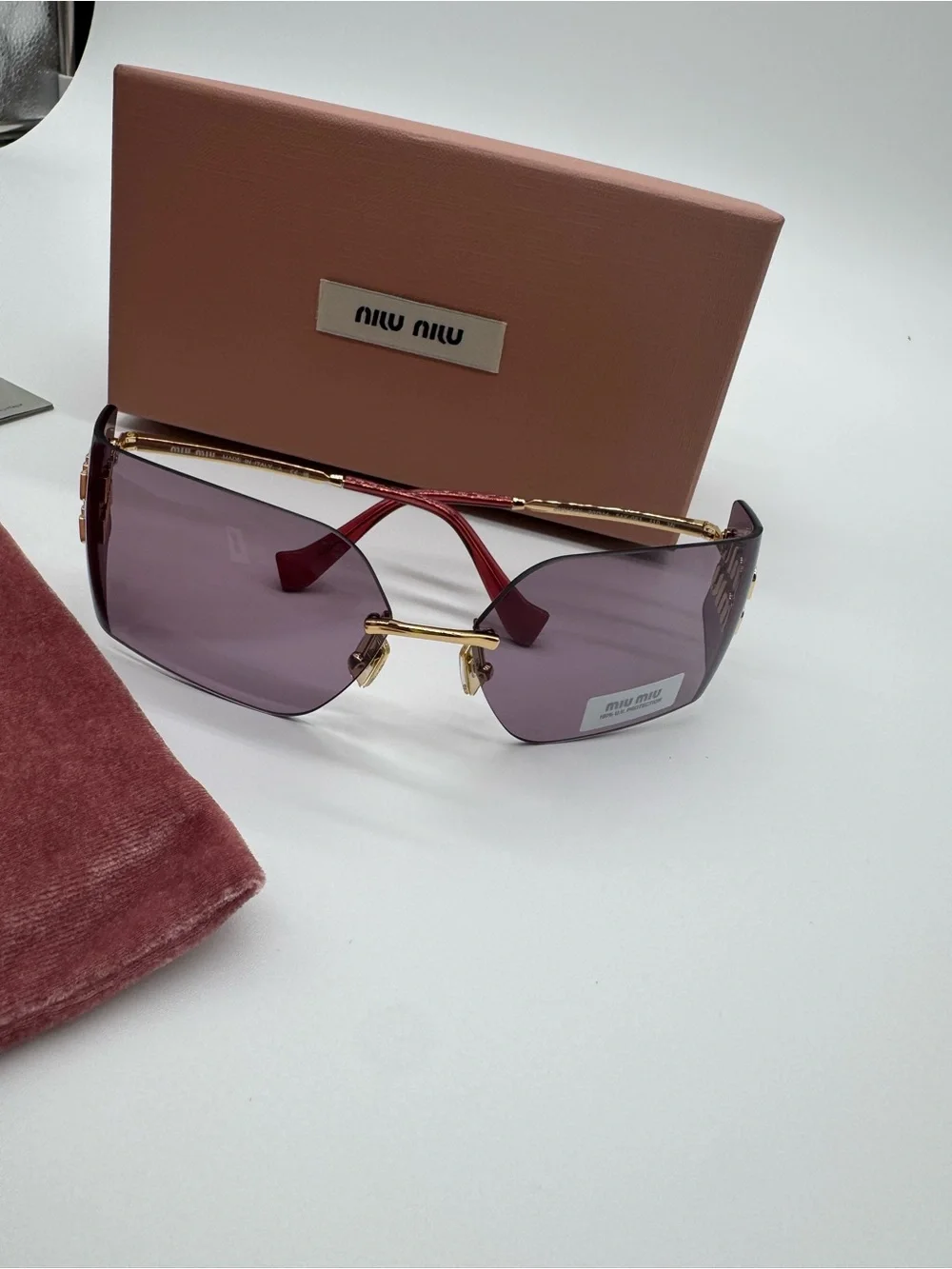 Miu Miu Purple Rimless Sunglasses with Gold Accents